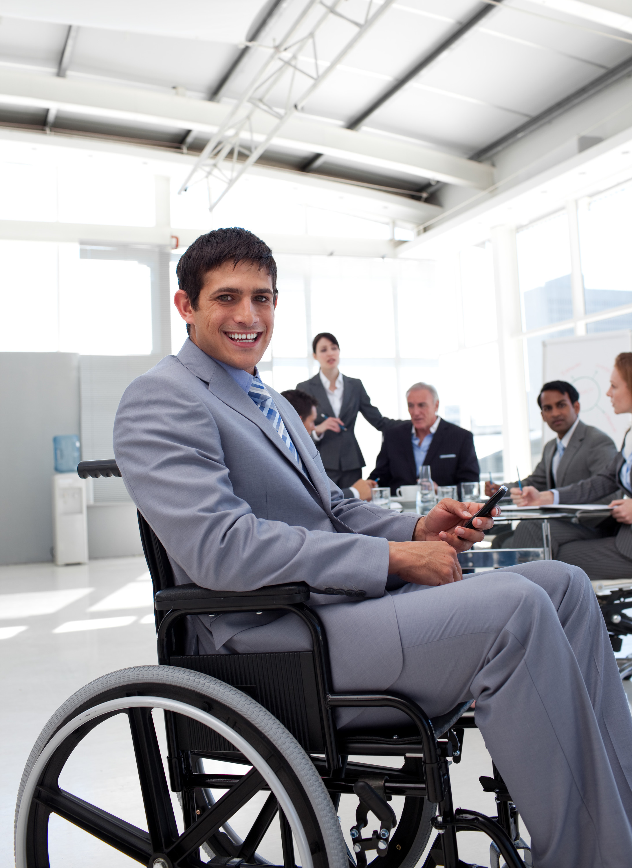 Smiling young man in wheelchair